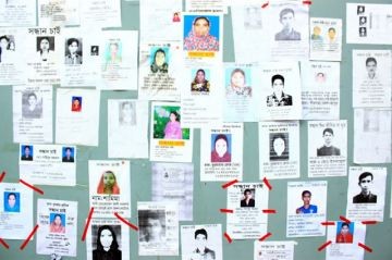 Board with photos of missing Rana Plaza garment workers, posted by relatives. Photo: Sharat Chowdhury. Licensed via Wikimedia Commons.