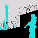 Man with gun standing next to wall with barbed wire along it