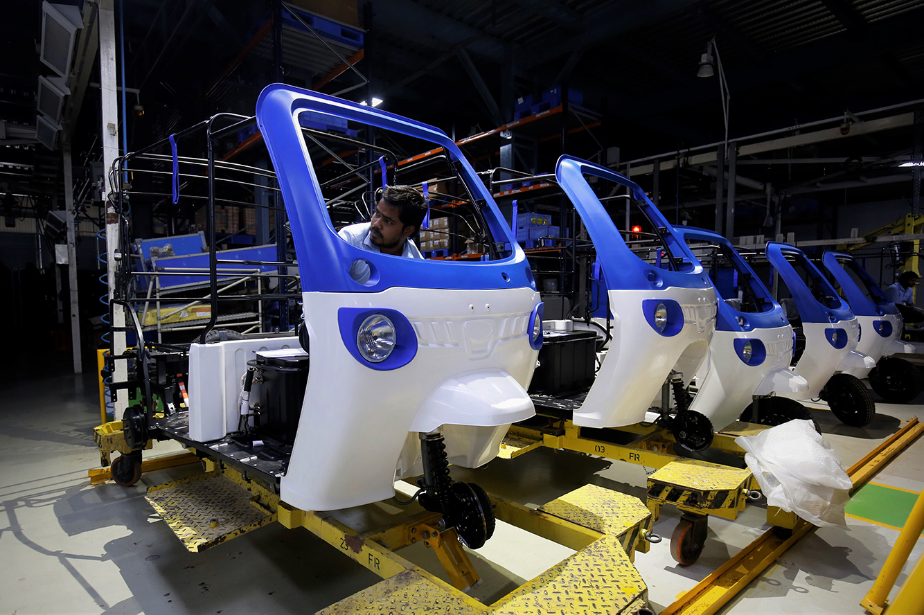 An employee on the assembly line of the Mahindra Treo e-auto factory in Bangalore, India. 