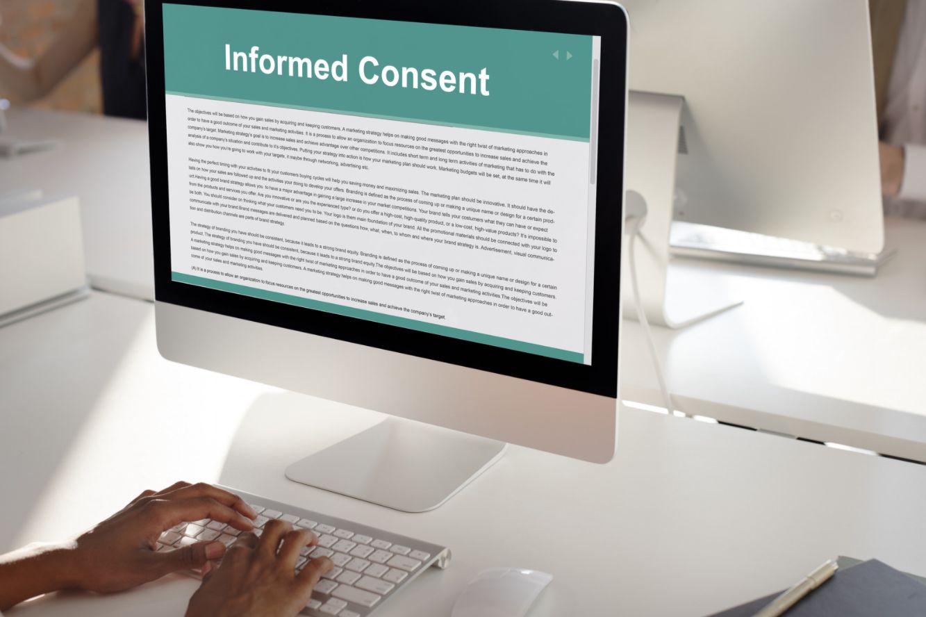 person reviewing consent form on computer