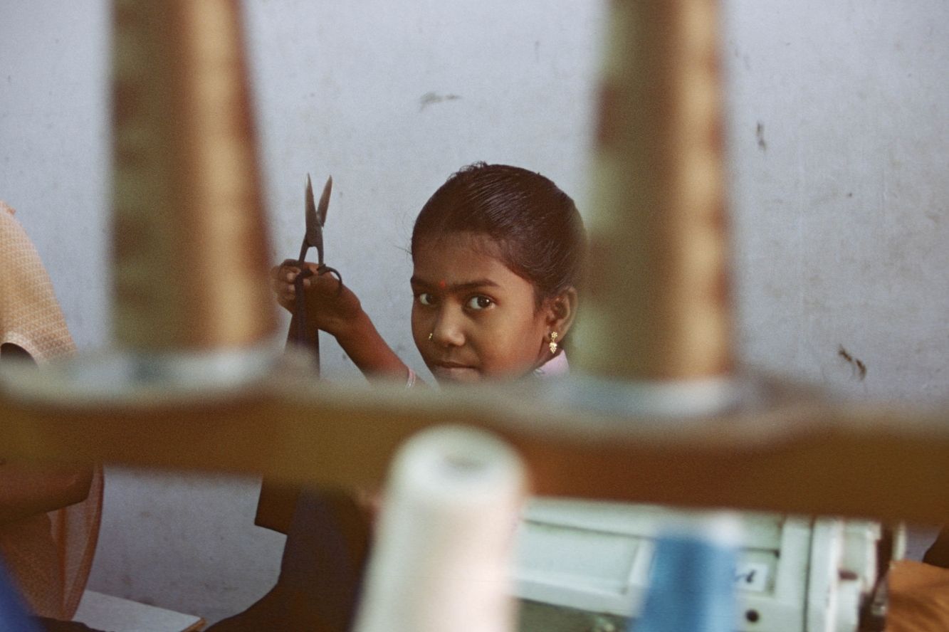 Young girl in sewing factory